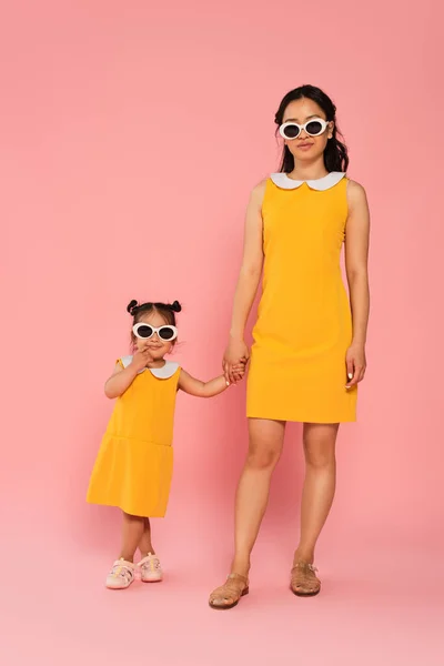 Cheerful Asian Woman Holding Hands Toddler Daughter Sunglasses Pink — Stock Photo, Image