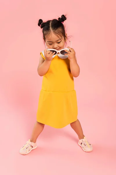 Full Length Asian Toddler Kid Yellow Dress Holding Sunglasses Pink — Stock Photo, Image