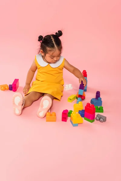 Asian Toddler Kid Yellow Dress Playing Building Blocks Pink — Stock Photo, Image