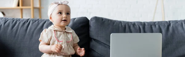 Baby Girl Sitting Blurred Laptop Couch Banner — Stock Photo, Image