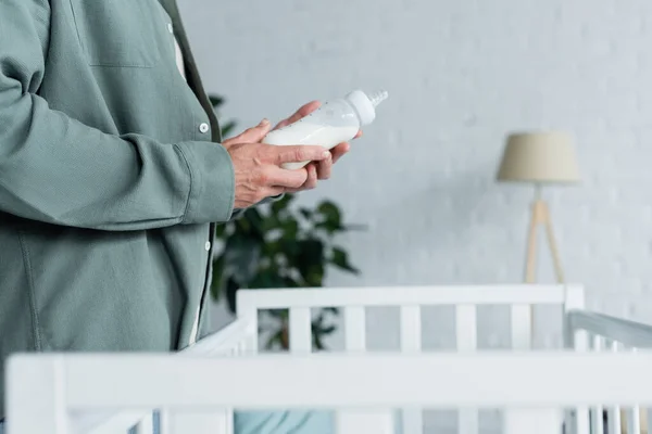 Cropped View Man Holding Baby Bottle Milk Crib — Stock Photo, Image