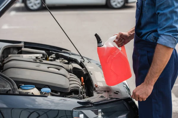 Cropped View Repairman Holding Windshield Washer Fluid Car Outdoors — 스톡 사진