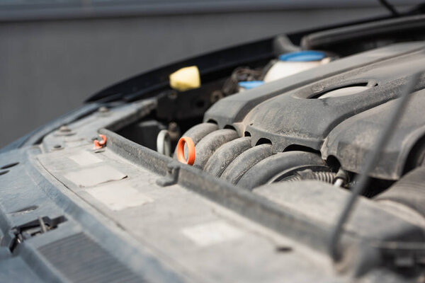 Close up view of motor of car outdoors 