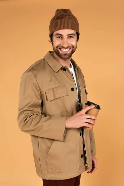 Cheerful Man Brown Beanie Jacket Standing Coffee Isolated Beige — Stock Photo, Image