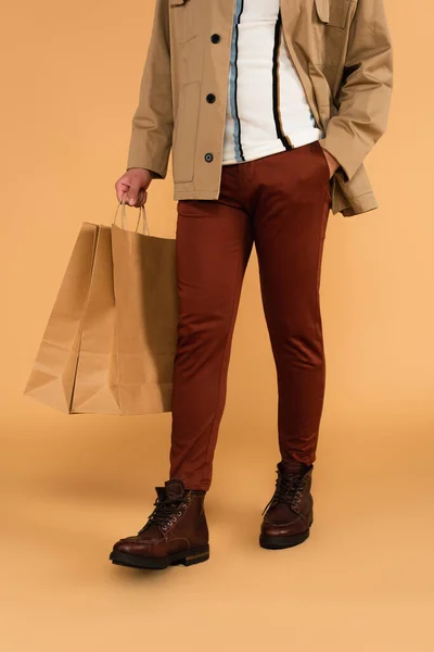 Cropped View Stylish Man Shopping Bags Hand Pocket Brown Pants — Stock Photo, Image