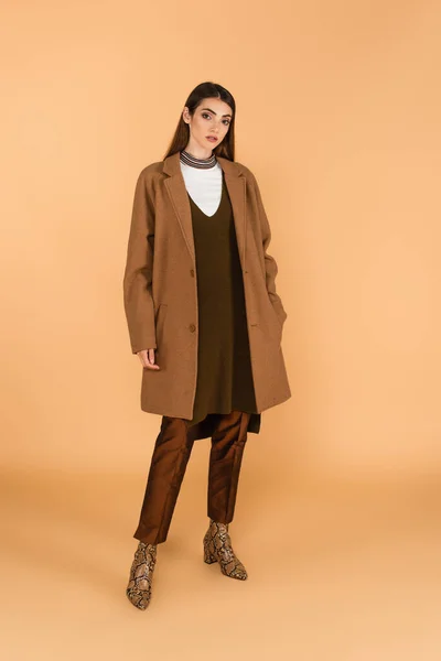 Fashionable Woman Holding Hand Pocket Trendy Coat Beige Background — Stock Photo, Image