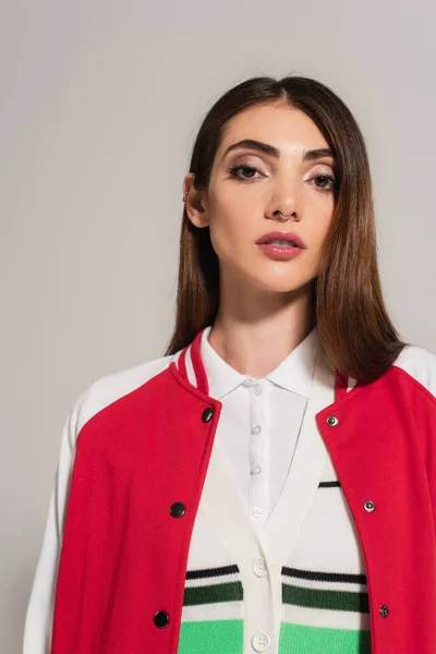 Young Brunette Woman Red White Jacket Looking Camera Isolated Grey — Fotografia de Stock