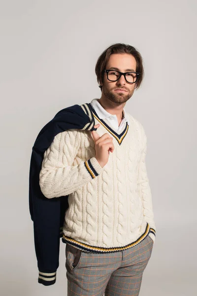 Trendy Man White Jumper Eyeglasses Posing Hand Pocket Isolated Grey — Stockfoto