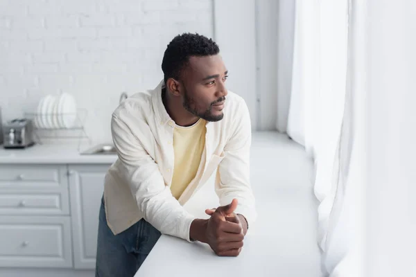 Pensive African American Man Clenched Hands Leaning Window Sill — Stock Photo, Image