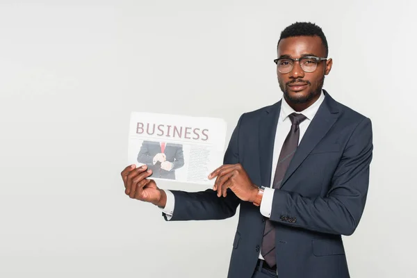 African American Man Eyeglasses Showing Business Newspaper Isolated Grey — Stock Photo, Image