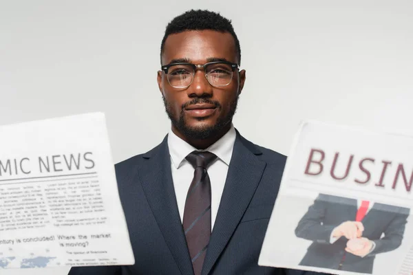 African American Man Eyeglasses Holding Newspapers Isolated Grey — Stock Photo, Image