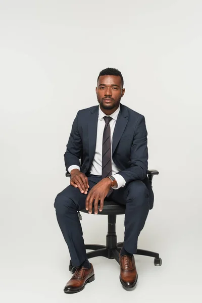 African American Businessman Suit Sitting Office Chair Isolated Grey — Stock Photo, Image