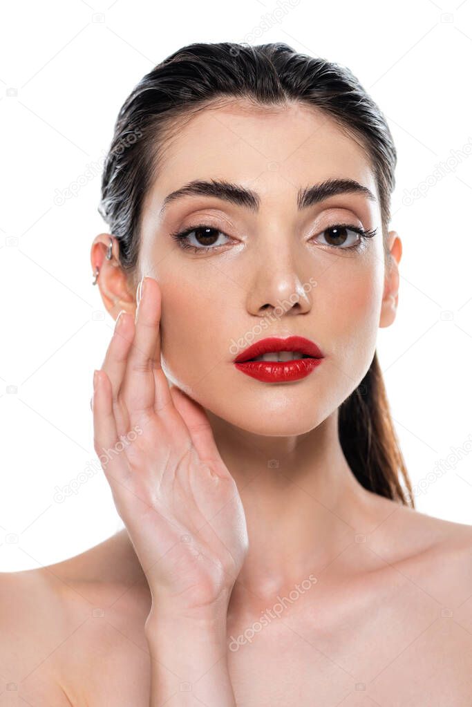 young woman with red lips touching face isolated on white