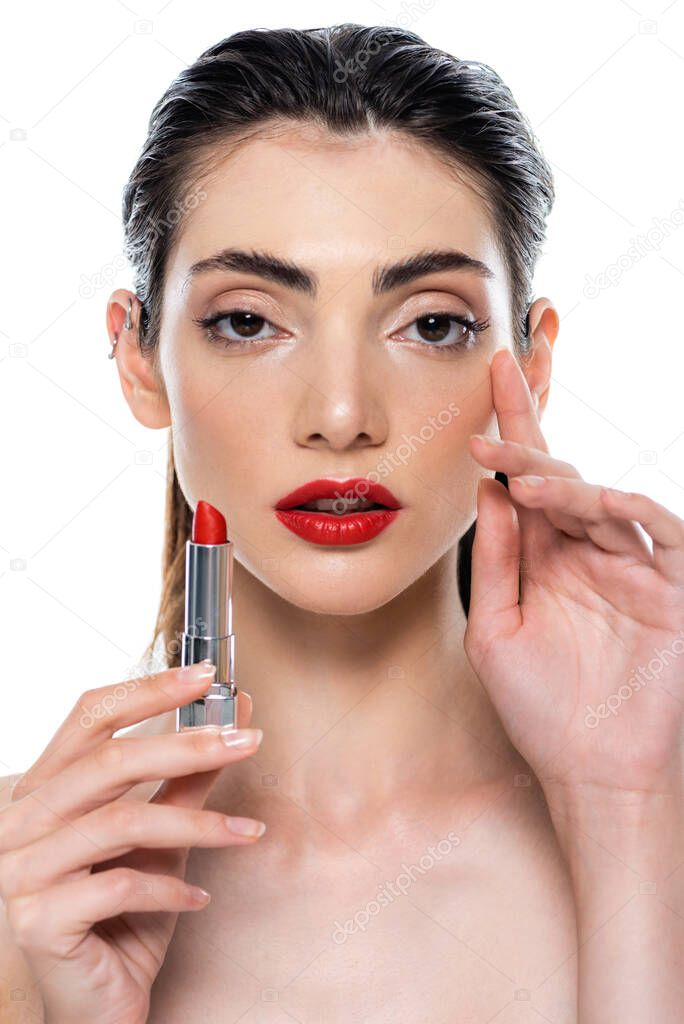 young woman with red lips holding lipstick isolated on white