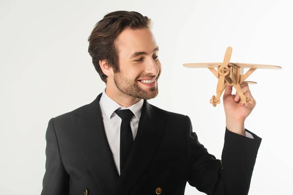 Hombre Negocios Alegre Mirando Avión Madera Aislado Blanco — Foto de Stock