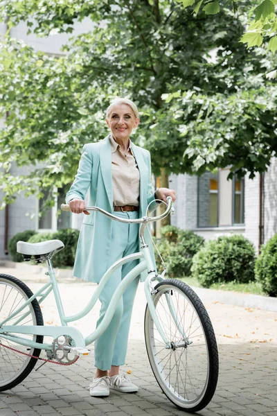 Senior Businesswoman Blue Suit Smiling Bicycle Urban Street — Stock Photo, Image