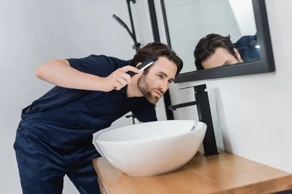 Plumber Flashlight Checking Sink Modern Bathroom — Stock Photo, Image