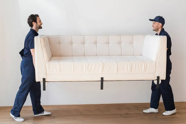 Side View Movers Carrying White Couch Living Room — Stock Photo, Image