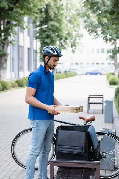 Side View Arabian Deliveryman Holding Pizza Boxes Thermo Backpack Bike — Stock Photo, Image