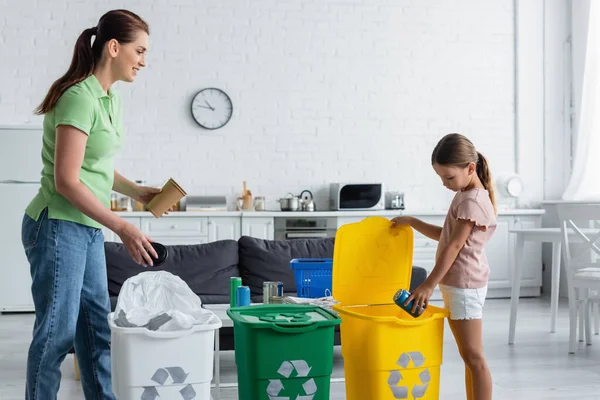 Smiling Woman Looking Daughter Tin Can Bin Recycle Sign Kitchen — Stock Photo, Image