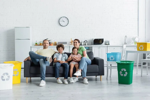 Happy Family Sitting Couch Trash Bins Boxes Recycle Sign Kitchen — Stock Photo, Image