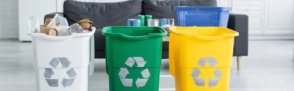 Trash bans with recycle sign at home, banner