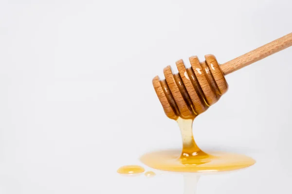 Fresh Golden Honey Flowing Wooden Dipper White Background — Stock Photo, Image