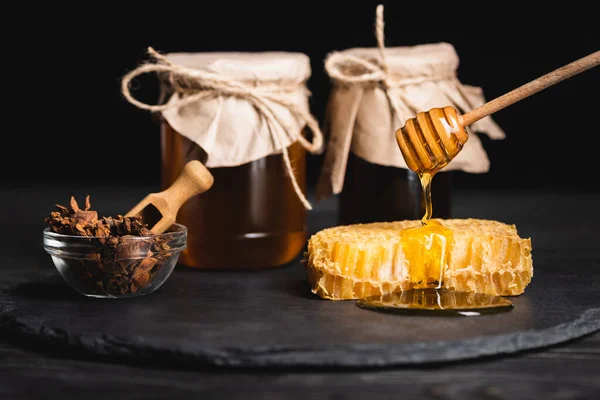 Wooden Dipper Liquid Honey Honeycomb Bowl Anise Seeds Blurred Jars — Stock Photo, Image