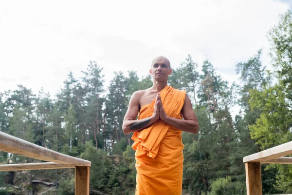 Low Angle View Buddhist Monk Meditating Praying Hands Wooden Fence — Stock Photo, Image