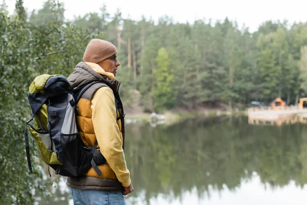 Hiker Backpack Looking Away While Standing Lake Forest — Stock Photo, Image