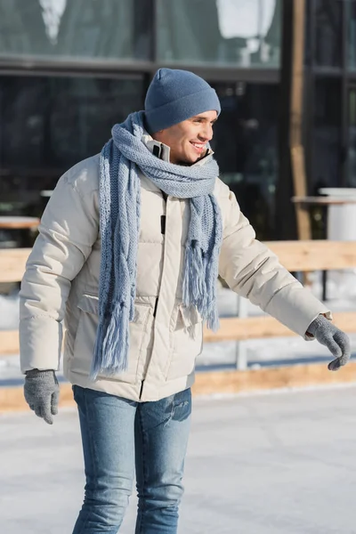 Pleased Young Man Scarf Winter Hat Ice Skates Skating Ice — Stock Photo, Image