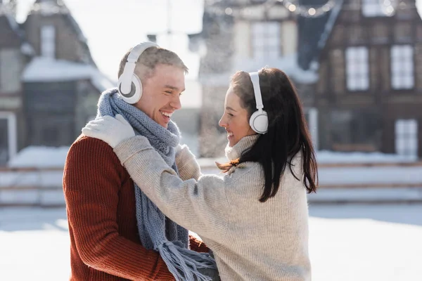 Side View Happy Couple Hugging While Listening Music Headphones — Stock Photo, Image