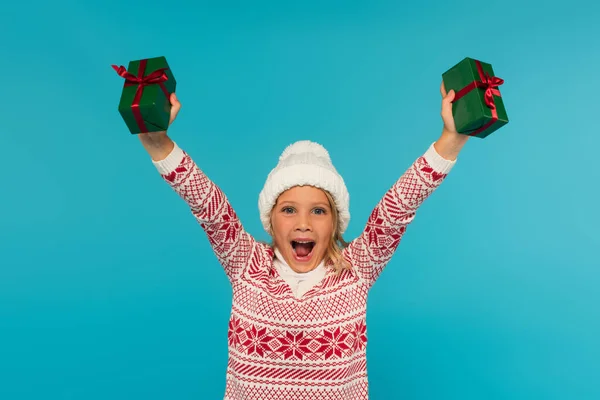 Excited Girl Warm Hat Sweater Holding Gifts Raised Hands Screaming — Stock Photo, Image