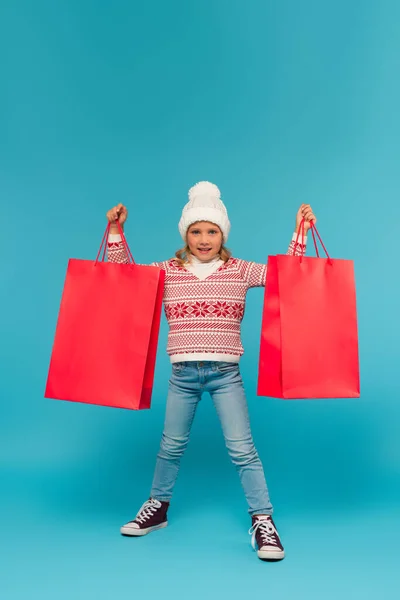 Stylish Child Warm Sweater Jeans Snickers Holding Shopping Bags Blue — Stock Photo, Image