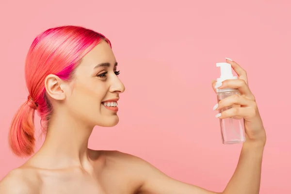 Happy Young Woman Colorful Hair Looking Bottle Toner Isolated Pink — Stock Photo, Image