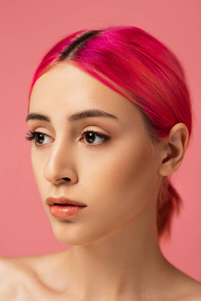 pretty young woman with colorful hair looking away isolated on pink 