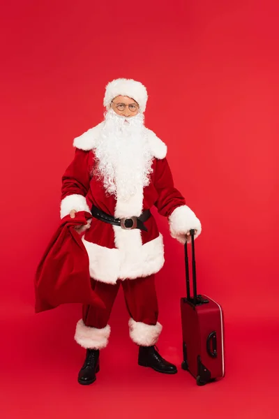 Santa Claus Holding Sack Suitcase Red Background — Stock Photo, Image