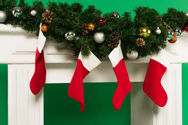 Christmas Stockings Fir Branches Fireplace Green Background — Stock Photo, Image