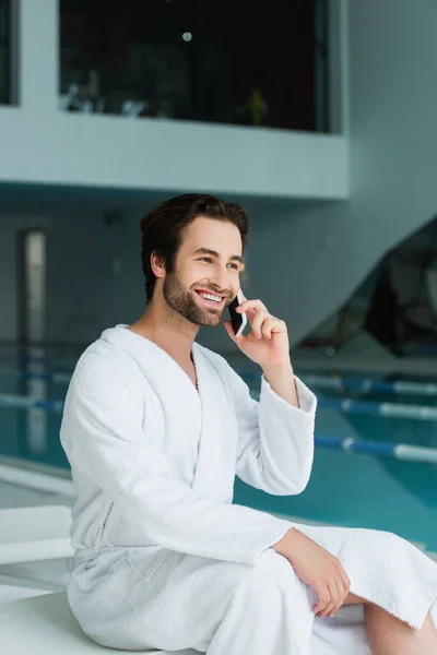 Cheerful Man Talking Smartphone Blurred Swimming Pool Spa Center — Stock Photo, Image