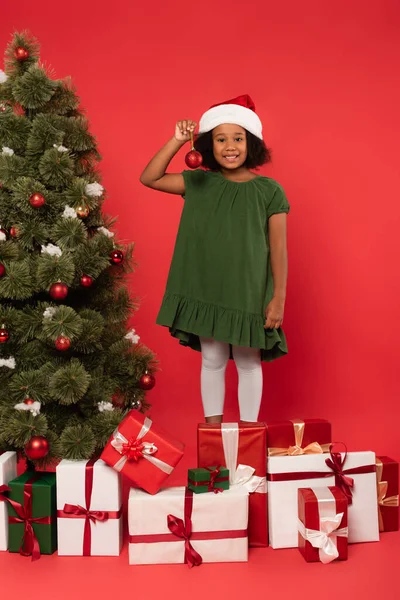 Smiling African American Child Santa Hat Holding Christmas Ball Presents — Stock Photo, Image