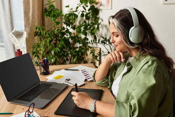 A woman with Waardenburg syndrome enjoys her creative time at home, showcasing her individuality.