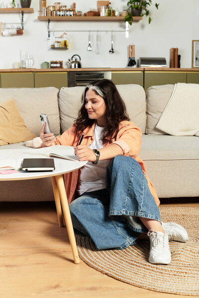 A woman with a unique white forelock relaxes in her stylish living space while reading.