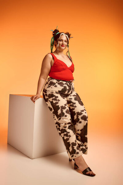 Cheerful young woman with a white forelock celebrates her unique beauty and style.
