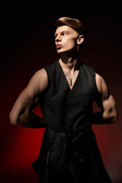 A confident young man poses with an alluring attitude, embodying modern masculinity in artful light.