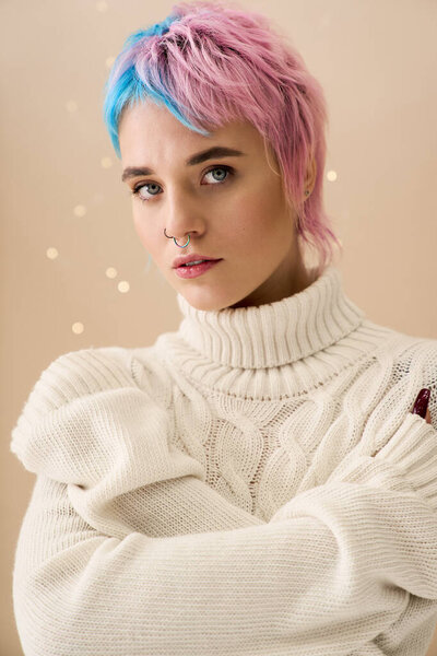 A young woman with pink and blue hair poses in a cozy white sweater, radiating winter charm.
