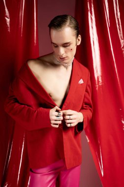 A man showcases confidence and individuality in a striking red outfit for Valentine Day.
