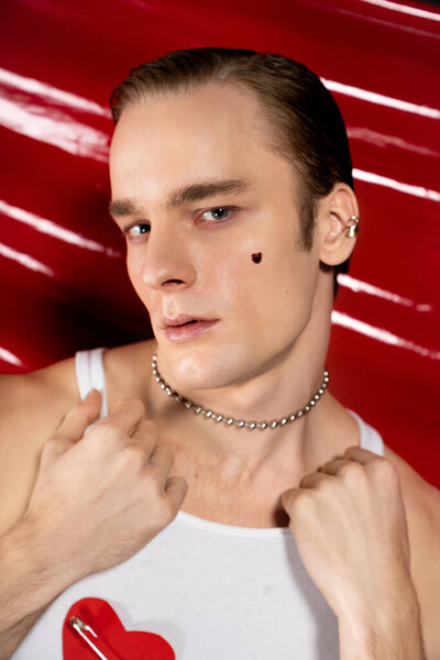 A proud man expresses his unique style and joy on Valentine Day, showcasing Queer love.