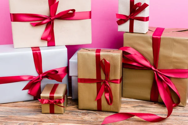 Wrapped gift boxes on pink background, new year concept — Stock Photo