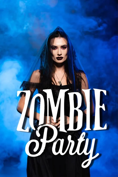 Bride in black dress and veil near zombie party lettering on blue with smoke — Stock Photo