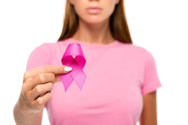 Cropped view of pink ribbon of breast cancer awareness in hand of woman on blurred background isolated on white — Stock Photo